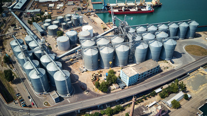aerial view of wheat silos storage in sea port © Alexander Belinskiy