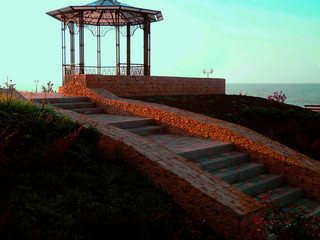Stairs leading to the gazebo by the sea.