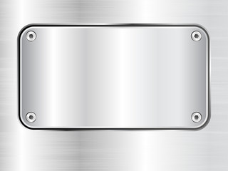 Metal plate background, steel nameplate with screws.