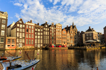 Exterior view of buildings at Damrak street in the old town part of Amsterdam - 165851037