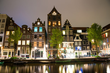 Fototapeta na wymiar View of the Amsterdam canals and embankments along them at night