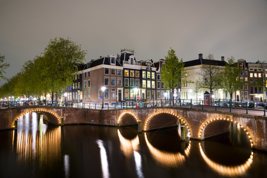 Canals of Amsterdam at night. Amsterdam is the capital of the Netherlands