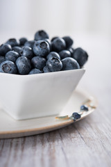 Fresh blueberries in white bowl