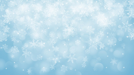 Naklejka na ściany i meble Christmas background of snowflakes with bokeh effect in light blue colors