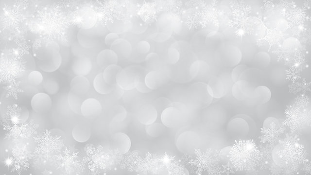 Christmas background with frame of snowflakes and bokeh effect