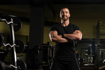 Fototapeta na wymiar Portrait Of A Muscular Man In Black Shirt