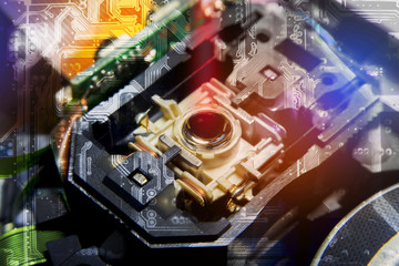 Close up macro, Laser Head reader of cd player system equipment installed on electronics circuit board, Double Exposure Circuit board pattern, illustration design, Electronics equipment concept.