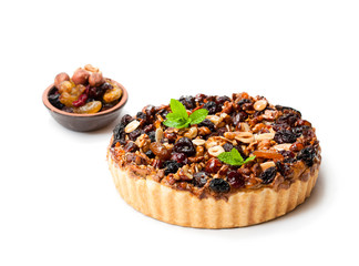 Delicious  tart with dried berries and nuts isolated on white