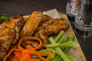 Fried chicken wings with sauce and salad