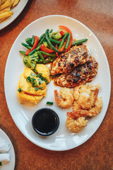 Roasted chicken breast and mashed potatoes and shrimp breaded