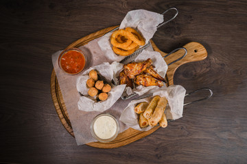Snack for beer in the form of nuggets cheese rings and fried chicken legs