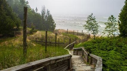 Fototapeta premium Walkway Into The Foggy Lakeshore