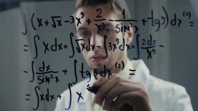 scientist wrote mathematical formulas on a blackboard