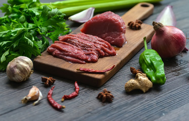 Raw beef meat on a cutting board