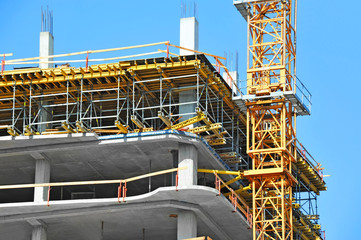 Crane and highrise construction site