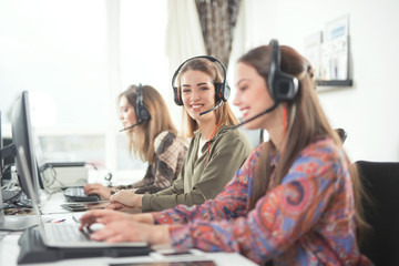 Group of busy young businesswomen working as call center operators