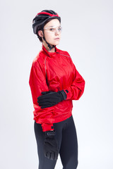 Sport Concepts and Ideas. Portrait of Caucasian  Female Cycling Athlete Posing Equipped in Professional Outfit in Studio.