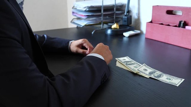 corruption, bribery and fraud concept - close up of businessman taking money. 4k, slow motion