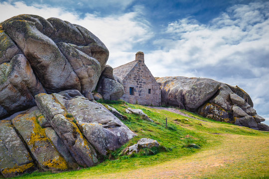 House between the rocks in Meneham village, Kerlouan, Finistere, Brittany (Bretagne), France