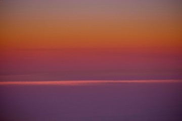 Fototapeta premium Above the Clouds 4 / Flying the friendly skies during a sunset was stunning, and makes a beautiful background.