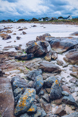 The pink granite rocks with strange shapes, coast in Brittany. The mass of enormous pink rocks, the pink granite, rock with strange shapes. Brittany (Bretagne), France