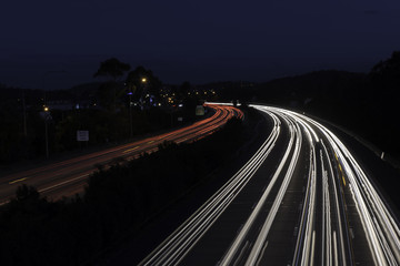 Fototapeta na wymiar motorway highway road car light trails at night time australia