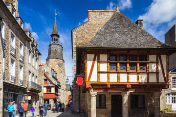 Narrow street with old traditional houses in histoical part of Dinan, Brittany (Bretagne), France
