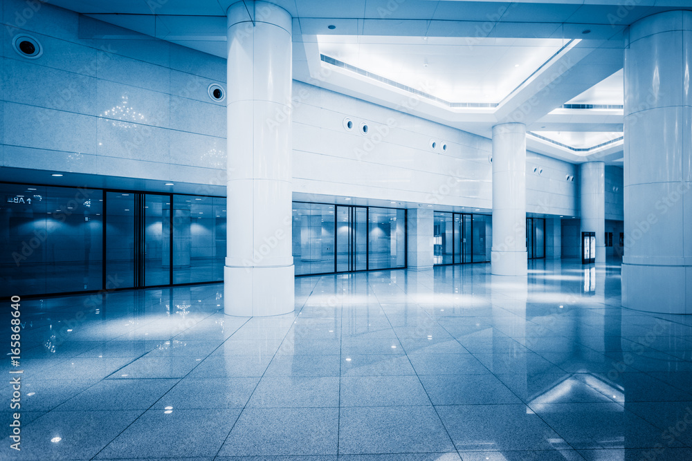 Sticker empty building hall with marbled floor,blue toned.