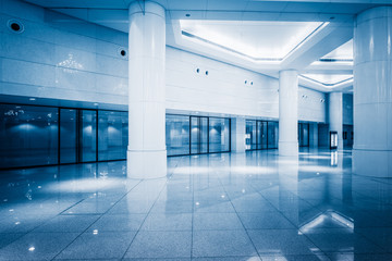 empty building hall with marbled floor,blue toned.