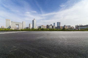 Panoramic skyline and buildings with empty road