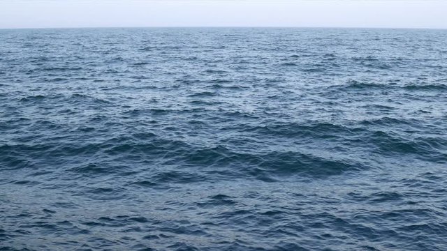 The sea picture. Background of the blue sea surface with small waves. Water background