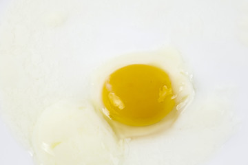 Half boiled egg isolated on white.