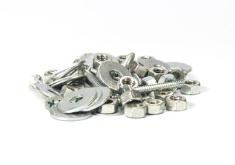 Pile of Hexagon nut and screw and fender washer on white background