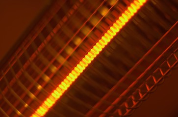 Hot coil of electrical heater behind the grate