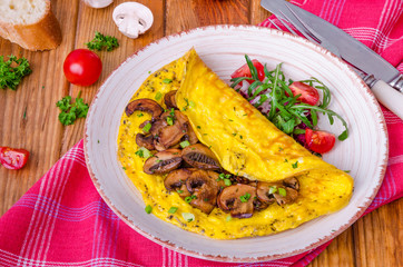 Omelette with fried mushrooms and herbs