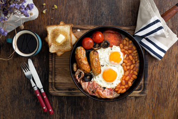 English breakfast with coffee on wooden table
