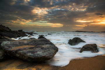 Sunset Seawaves and an empty beach