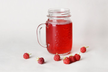 Raspberry drink in a glass jar.
