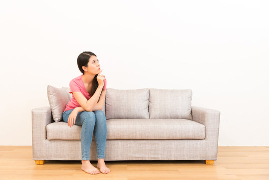 Pretty Casual Woman Sitting On The Couch