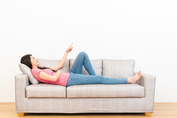 beautiful young woman lying on wooden floor sofa