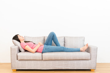 housewife lying on the couch and resting sleeping