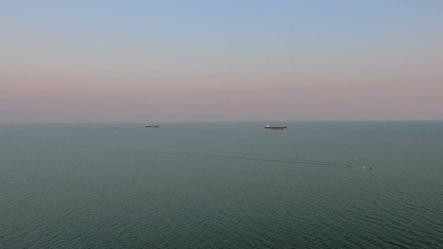 Aerial view over cargo transport ship on sea