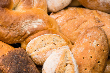 close-up various types of fresh homemade bread, background