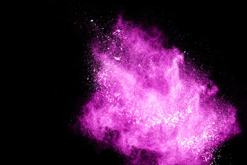 abstract  purple powder splatted on black background,Freeze motion of color powder exploding.