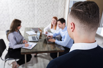Businessman Looking At His Colleague