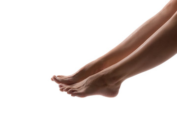 Beautiful women feet isolated on white close-up