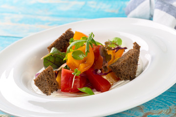 Fresh vegetable salad on wooden background
