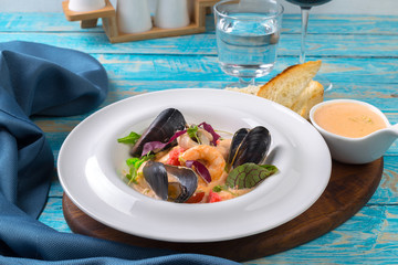Tasty seafood on plate on table close-up
