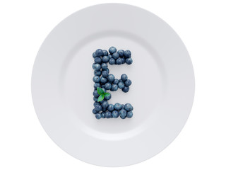 Blueberry font isolated on white ceramic dish. Letter E