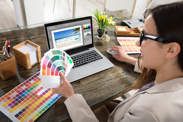 Designer Holding Colour Swatches In Her Hand